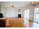 Open living space with wood floors, a fireplace, and sliding glass doors to the backyard at 2263 Leicester Se Way, Atlanta, GA 30316