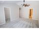 Spacious primary bedroom with carpet flooring, a ceiling fan, and access to an ensuite bathroom at 2263 Leicester Se Way, Atlanta, GA 30316