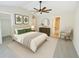 Inviting primary bedroom with a ceiling fan, neutral walls, and ensuite access at 2263 Leicester Se Way, Atlanta, GA 30316