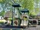 Community playground featuring climbing structures, slides, and shade at 2263 Leicester Se Way, Atlanta, GA 30316