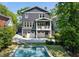 Aerial view of a home with a pool and lots of tree coverage around the property and neighborhood at 331 Peachtree Ne Ave, Atlanta, GA 30305