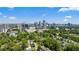 Stunning aerial view featuring the city skyline and lush green trees at 331 Peachtree Ne Ave, Atlanta, GA 30305