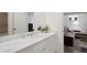 Modern bathroom with a large vanity, mirror, and adjacent rec room at 331 Peachtree Ne Ave, Atlanta, GA 30305