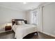 Cozy bedroom with dark wood floors and a comfortable bed at 331 Peachtree Ne Ave, Atlanta, GA 30305