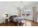 Inviting bedroom with modern lighting, hardwood floors, and window views at 331 Peachtree Ne Ave, Atlanta, GA 30305