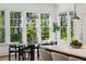 Bright breakfast nook featuring modern chairs and table with natural light streaming in from the large windows at 331 Peachtree Ne Ave, Atlanta, GA 30305