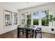Dining area with modern table and chairs, large windows, and natural light at 331 Peachtree Ne Ave, Atlanta, GA 30305