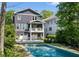 Two-story home with a swimming pool, two-car garage, and balcony at 331 Peachtree Ne Ave, Atlanta, GA 30305