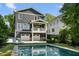 Beautiful home exterior featuring a pool, balcony, and two-car garage at 331 Peachtree Ne Ave, Atlanta, GA 30305