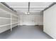 Spacious two-car garage with shelving and painted floor at 331 Peachtree Ne Ave, Atlanta, GA 30305