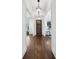 Hallway with hardwood floors, white trim, and pendant lights at 331 Peachtree Ne Ave, Atlanta, GA 30305