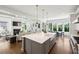 Open concept kitchen with large island, stainless appliances, and views to the living and dining areas at 331 Peachtree Ne Ave, Atlanta, GA 30305