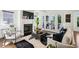Cozy living room with fireplace, modern decor, and abundant natural light at 331 Peachtree Ne Ave, Atlanta, GA 30305