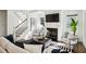 Living room with fireplace, staircase, and comfortable seating at 331 Peachtree Ne Ave, Atlanta, GA 30305