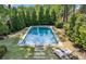 Inviting backyard pool area with lounge chairs and manicured lawn at 331 Peachtree Ne Ave, Atlanta, GA 30305