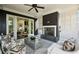 Inviting covered porch with fireplace, comfortable seating, and access to the living room at 331 Peachtree Ne Ave, Atlanta, GA 30305