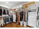 Organized walk-in closet with custom shelving and hanging racks at 331 Peachtree Ne Ave, Atlanta, GA 30305