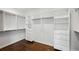 Spacious walk-in closet with custom shelving and storage solutions at 331 Peachtree Ne Ave, Atlanta, GA 30305