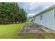 Home with a well-maintained lawn, patio, and vinyl siding at 8051 Trinity Park Dr, Riverdale, GA 30296