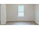 Neutral bedroom featuring a window with blinds, neutral walls, and carpet at 8051 Trinity Park Dr, Riverdale, GA 30296
