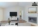 Bright living room view showcasing fireplace and modern decor at 8051 Trinity Park Dr, Riverdale, GA 30296