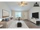 Bright living room with modern decor, natural light and hardwood floors at 8051 Trinity Park Dr, Riverdale, GA 30296