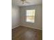 Clean bedroom with ceiling fan, new flooring, and a bright window with views at 1304 Old Coach Sw Rd, Marietta, GA 30008