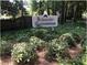 Bellemeade Condominium signage surrounded by green foliage and an American flag at 1304 Old Coach Sw Rd, Marietta, GA 30008