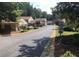 Scenic street view of well-maintained townhomes in a quiet, tree-lined community at 1304 Old Coach Sw Rd, Marietta, GA 30008