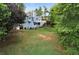 Expansive backyard with a well-manicured lawn, mature trees, and a partial view of the home at 31 Clearview Dr, Cartersville, GA 30121