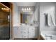 Bright bathroom with double vanity, white cabinets, and a glass-enclosed shower at 31 Clearview Dr, Cartersville, GA 30121