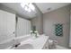Bathroom features a single vanity, large mirror, and shower/tub combo at 31 Clearview Dr, Cartersville, GA 30121