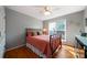 Bedroom features a metal bed frame, hardwood floors and a window view at 31 Clearview Dr, Cartersville, GA 30121