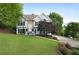 Charming home with a well-manicured lawn, beautiful landscaping, and a concrete driveway at 31 Clearview Dr, Cartersville, GA 30121