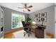 Home office featuring a modern desk, hardwood floors and ample natural light at 31 Clearview Dr, Cartersville, GA 30121