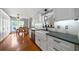 Eat-in kitchen with white cabinets, stainless steel appliances and bright lighting at 31 Clearview Dr, Cartersville, GA 30121