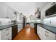 Spacious kitchen showcasing white cabinets, hardwood floors and stainless steel appliances at 31 Clearview Dr, Cartersville, GA 30121