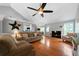 Bright living room with hardwood floors, high ceilings, a fireplace, and multiple seating areas at 31 Clearview Dr, Cartersville, GA 30121