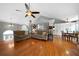 Open-concept living room with hardwood floors, high ceilings, and a view of the upper level at 31 Clearview Dr, Cartersville, GA 30121