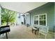 Covered outdoor patio space with comfortable seating, an outdoor grill, and natural light at 31 Clearview Dr, Cartersville, GA 30121