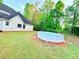 Spacious backyard featuring an above ground pool and lush lawn, perfect for outdoor activities at 515 Sherwin Ct, Mcdonough, GA 30252