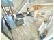 Open-concept living room featuring comfortable furniture, a large rug, and natural light at 515 Sherwin Ct, Mcdonough, GA 30252