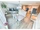 Open-concept living room and kitchen with modern design and hardwood floors at 515 Sherwin Ct, Mcdonough, GA 30252