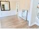 Bright living room with neutral walls, modern flooring, and a view into the kitchen at 515 Sherwin Ct, Mcdonough, GA 30252