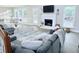Inviting living room with a gray sectional sofa and fireplace at 515 Sherwin Ct, Mcdonough, GA 30252