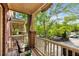 Private outdoor balcony with shade, seating, and a lush neighborhood view at 833 Charles Bank Se Ave, Atlanta, GA 30312