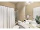 Bathroom with a shower-tub combo, vanity with sink, toilet, and mirror at 833 Charles Bank Se Ave, Atlanta, GA 30312