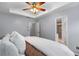 This large bedroom features a large bed with a neutral paint scheme, a trey ceiling, and a door leading to a bath at 833 Charles Bank Se Ave, Atlanta, GA 30312
