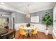 Open dining area with hardwood floors, statement lighting, modern decor, and natural light at 833 Charles Bank Se Ave, Atlanta, GA 30312