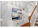 Hallway with hardwood floors, white trim, staircase, and artwork at 833 Charles Bank Se Ave, Atlanta, GA 30312